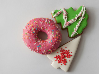 Christmas tree shaped cookies over wood background