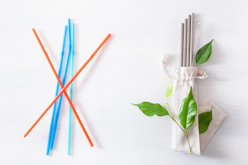 single use plastic and reusable metal eco-friendly drinking straw. zero waste concept