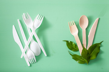 harmful plastic cutlery and eco friendly wooden cutlery. plastic free concept