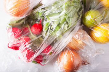 single use plastic waste issue. fruits and vegetables in plastic bags