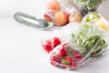 single use plastic waste issue. fruits and vegetables in plastic bags