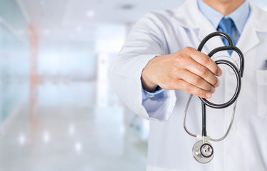 unrecognizable male doctor offering out an stethoscope