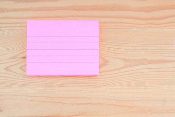 blank note paper on wooden background