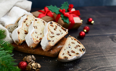 Christmas Stollen sliced on a wooden table. Christmas dessert. Recipe for Austrian and German cuisine. christmas in Europe