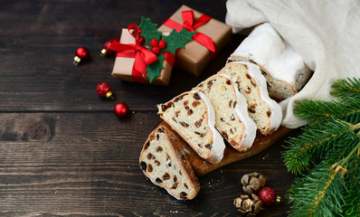 Christmas Stollen sliced on a wooden table. Christmas dessert. Recipe for Austrian and German cuisine. christmas in Europe