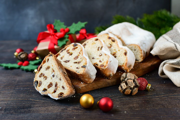 Christmas Stollen sliced on a wooden table. Christmas dessert. Recipe for Austrian and German cuisine. christmas in Europe