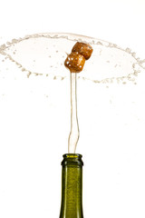 opening a bottle of champagne, cork flyes out of the bottle with splashes