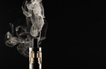 VAPE, electronic cigarette soaring, Smoking on a black background.