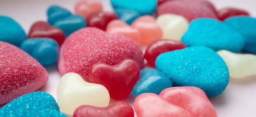 Valentines day flat lay with red, pink, blue white hearts. Beautiful background of candy and sweets, top view.