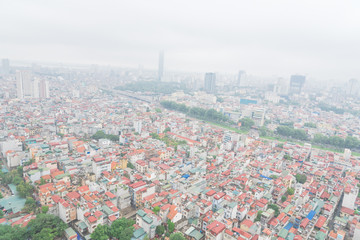 Top view high-density housing along To Lich River in Hanoi, Vietnam foggy day