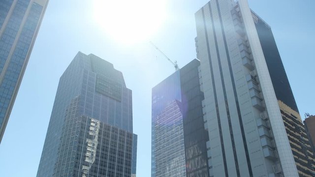 slow panoramic motion of buenos aires argentina city skyline skyscraper tower with sun