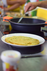 Fresh egg omelette,  placed on table in the kitchen counter