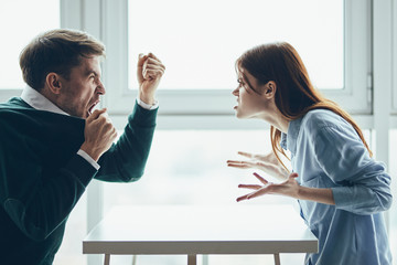 man and woman in office