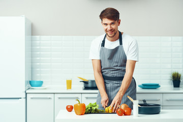 man preparing food in the kitchen