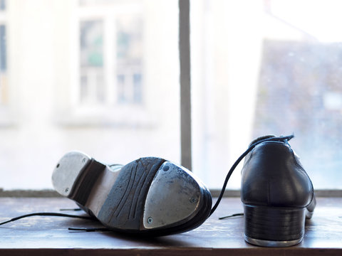 Step dancing shoes on a window sill