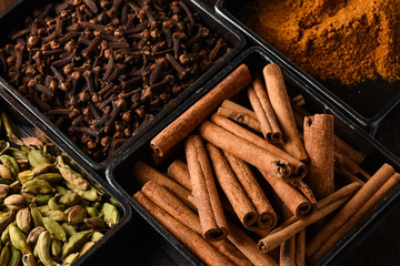 cinnamon sticks on wooden background