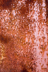Rusty orange background. Rust texture on an old metal wall. Grunge rusted metal texture. Rusty corrosion and oxidized background. Worn metallic iron panel