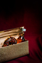 Womans formal clutch with donut and wine inside