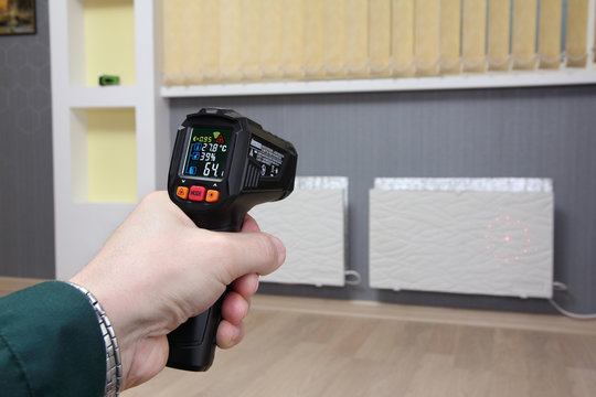 Infrared thermometer in hand