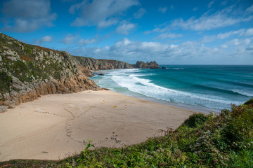 Fototapeta na wymiar View of Porthcurno Beach in south Cornwall on a cloudy September day.