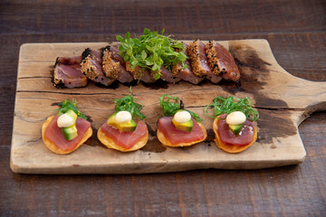 wooden plate sirloin meat and tomato salad