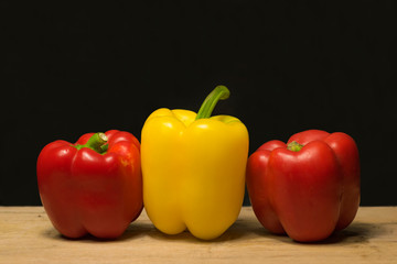 peppers on wooden background