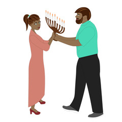 Young couple with hanukkah candles.
