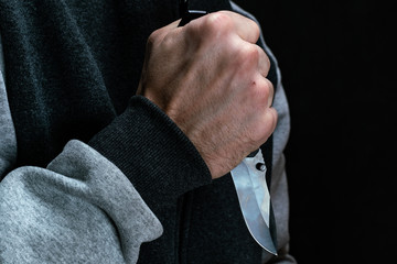 Knife in the hand of a criminal