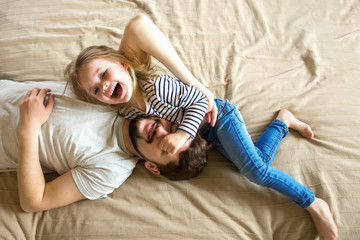 Father and daughter play together at home. 