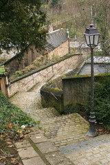 Luxembourg - The hidden tiny steep stone alleway staircase and old-style street lamp in old city