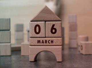March 6 written with wooden blocks