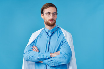 portrait of a young doctor with folded arms crossed