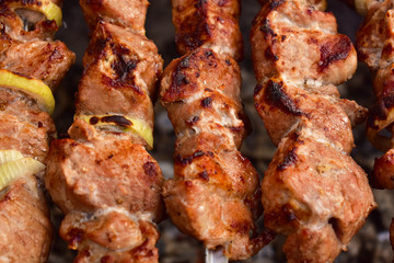 fried meat cooked and hanging on fire