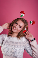 beautiful european girl with tangerines, candy. Girl and New Year.
