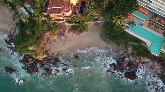 Aerial view on Amapas beach in Puerto Vallarta. Drone footage of sandy beach in Jalisco Mexico.