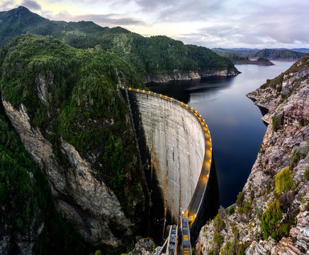 Gray concrete bridge beside water dam