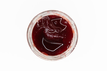 Red jam isolated over white background