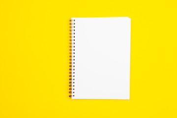 Empty white paper page on a yellow background
