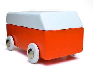Wooden toy car against a white background