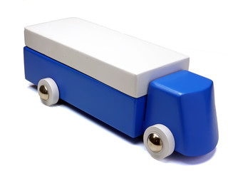 Wooden toy car against a white background