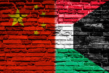 Flag of China and Kuwait on brick wall