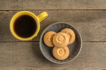 cookies and mug of coffee on a wooden table