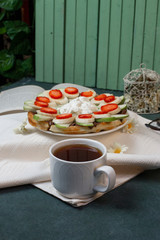  sweet snacks, book and cup of tea