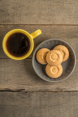 cookies and mug of coffee on a wooden table