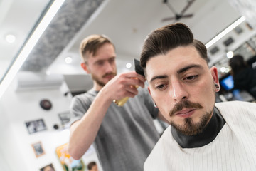 Fototapeta premium Men's haircut and hair styling. Men's beauty and hair care. 