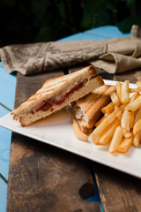 Club-sandwich with french fries