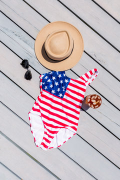 Hat and monokini on floor