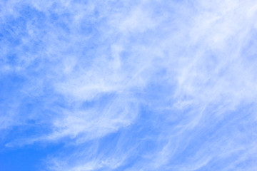 White cirrus clouds in the blue sky