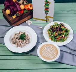 tasty mushrooms soups and mushrooms salads on the table