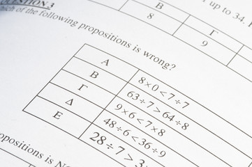 Exam paper with mathematics problem solving.